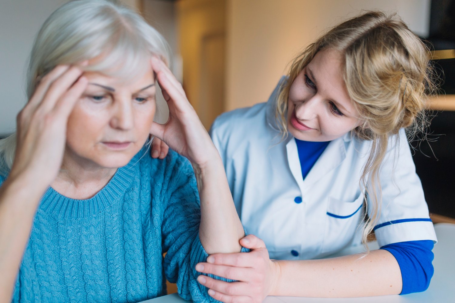 memory care patient getting helped by caretaker