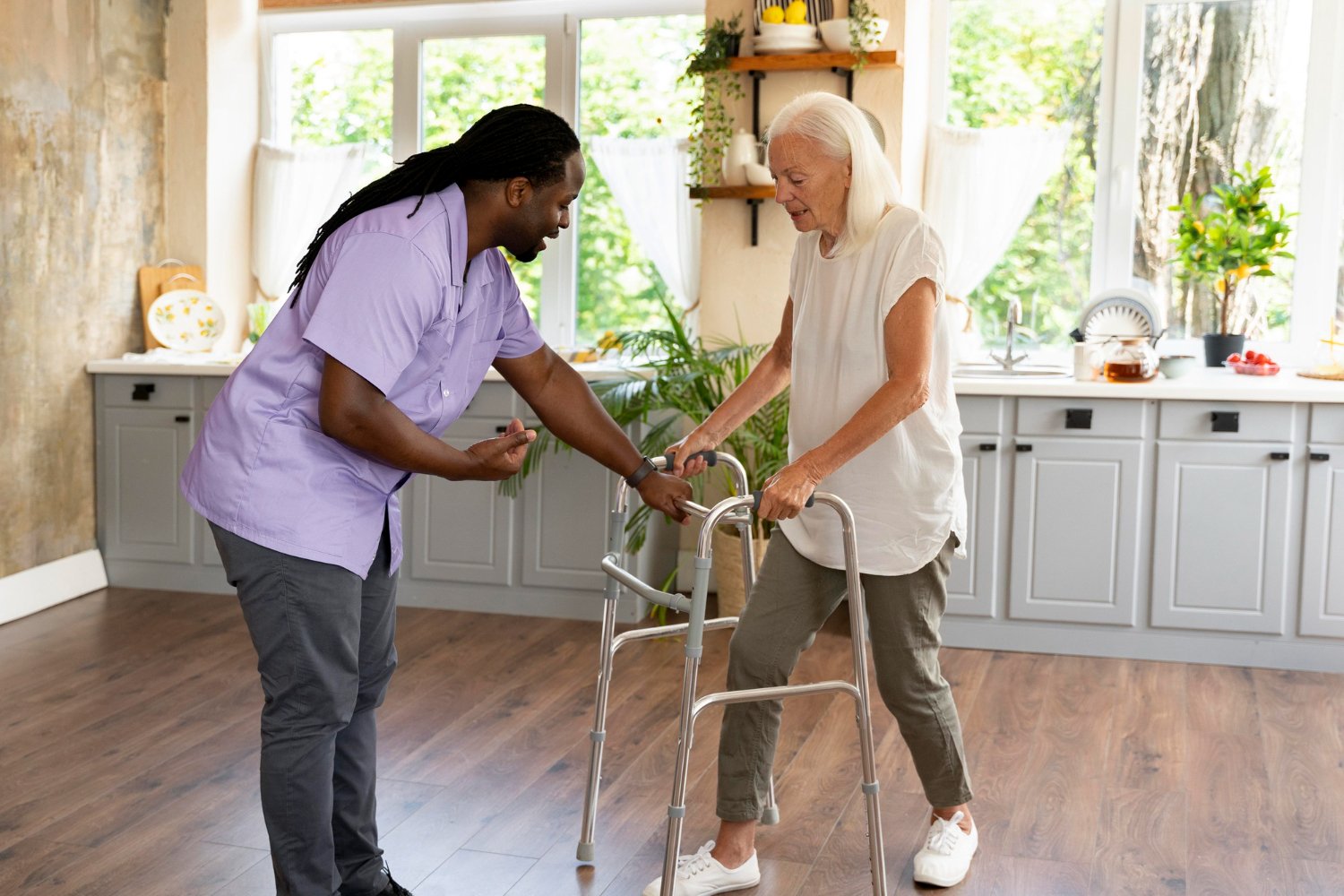 male care taker helping senior lady