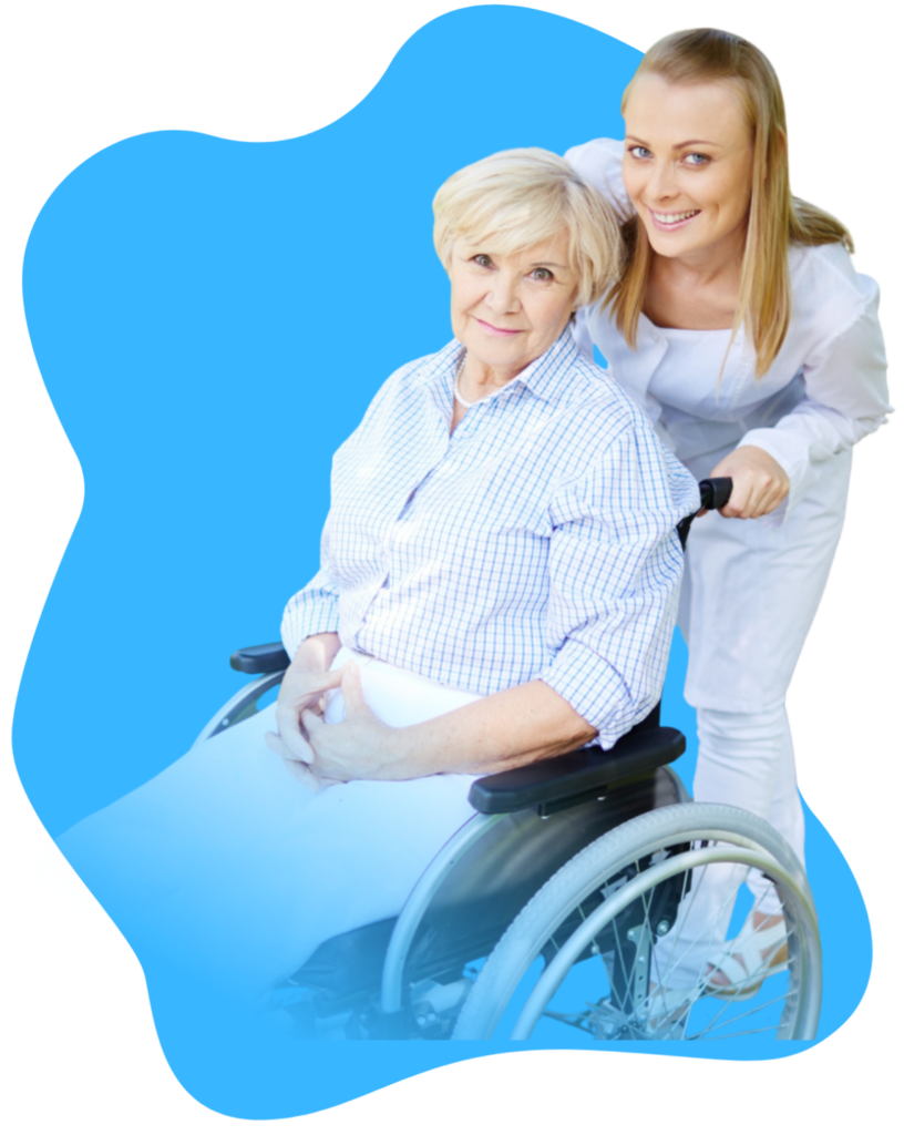 caretaker standing behind an elderly woman in a wheelchair