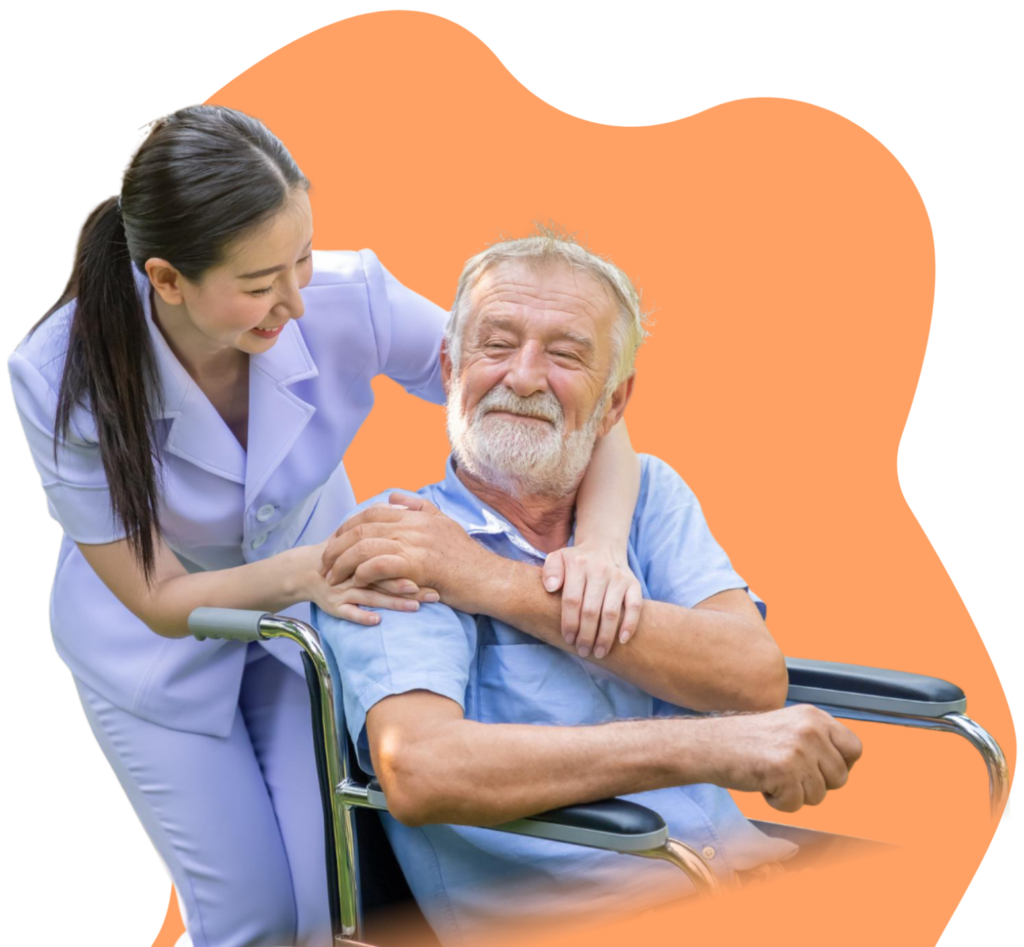female caretaker hugging old man in wheelchair
